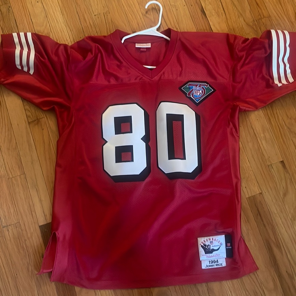 Red Mitchell & Ness 49ers Jerry Rice jersey.